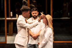 Taku Mutero (Claudio), Richard Peralta (Friar) and Claire Wetherall (Hero) in Much Ado About Nothing. Photo by Johan Persson.