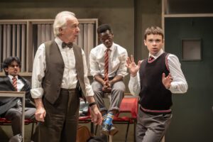 The History Boys – Simon Rouse as Hector with Mahesh Parmar (Akthar), Tashinga Bepete (Crowther) and Lewis Cornay (Posner) – Credit Marc Brenner